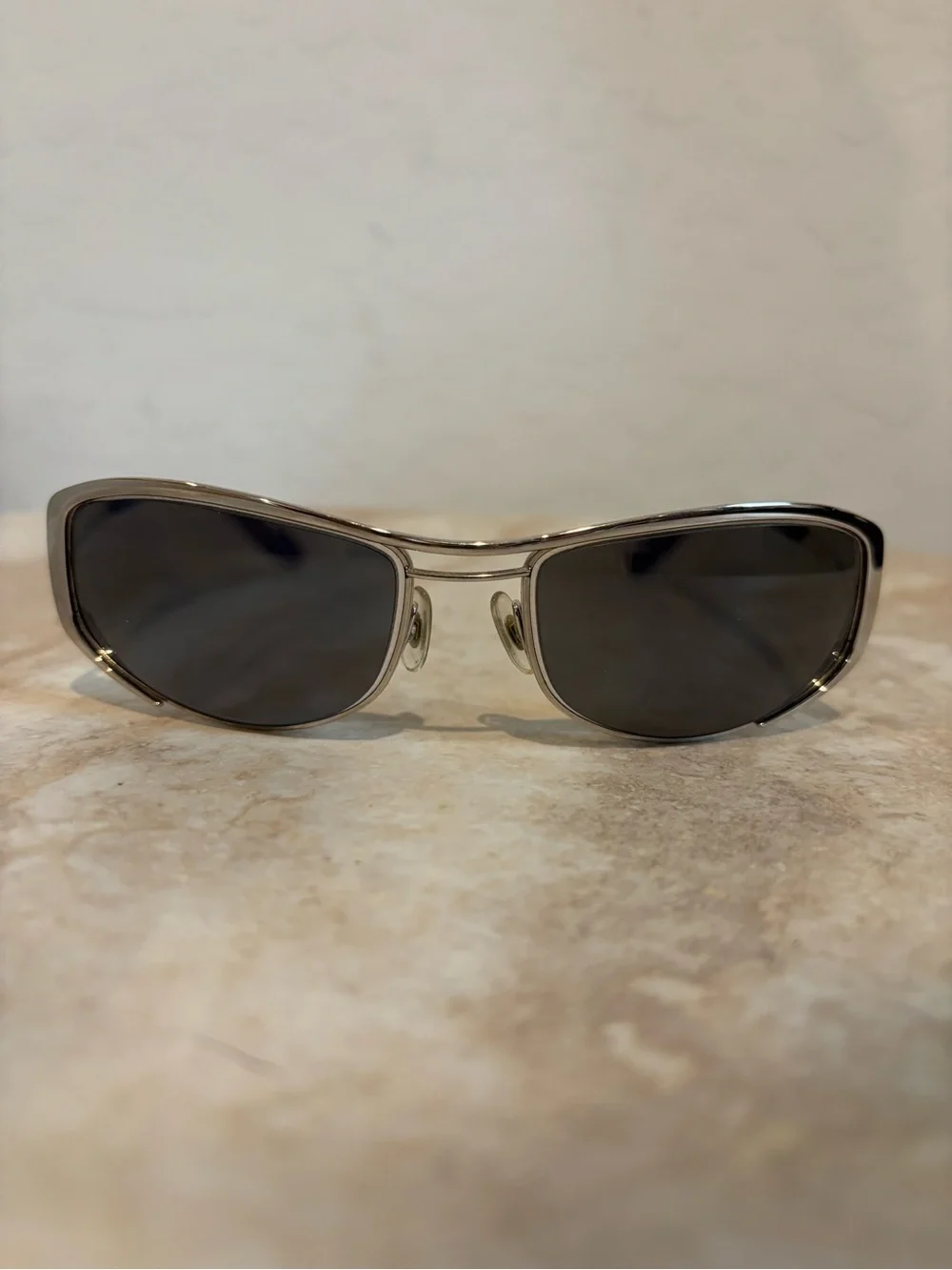 Hiero Elongated Oval Sleek Silver Frame Sunglasses with Dark Lenses